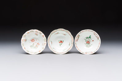 Three sets of Chinese famille verte cups and saucers with birds and flowers, various marks, Kangxi
