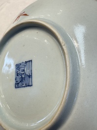 Four Chinese famille rose saucers and a gilt-decorated powder-blue-ground saucer, Qianlong and Jiaqing marks, 18/19th C.