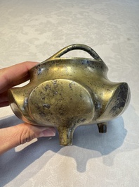 A Chinese bronze flower-shaped tripod censer with handles, Xuande mark, 19th C.