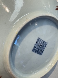 Four Chinese famille rose saucers and a gilt-decorated powder-blue-ground saucer, Qianlong and Jiaqing marks, 18/19th C.