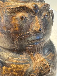 Three khmer-style brown-glazed anthropomorphic gourd-form bottles, probably 12/13th C.