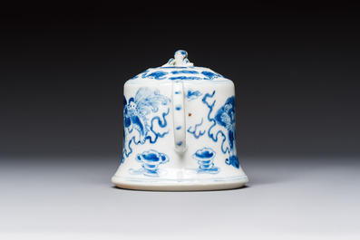 A Chinese blue and white 'Buddhist Lion' teapot, covered bowl and a saucer, various marks, 19th C.