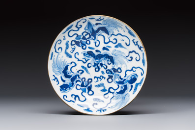 A Chinese blue and white 'Buddhist Lion' teapot, covered bowl and a saucer, various marks, 19th C.