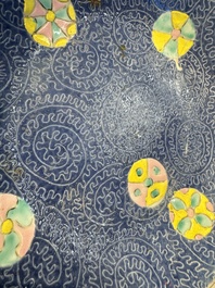 Four Chinese famille rose saucers and a gilt-decorated powder-blue-ground saucer, Qianlong and Jiaqing marks, 18/19th C.