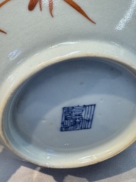 Four Chinese famille rose saucers and a gilt-decorated powder-blue-ground saucer, Qianlong and Jiaqing marks, 18/19th C.