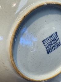 Four Chinese famille rose saucers and a gilt-decorated powder-blue-ground saucer, Qianlong and Jiaqing marks, 18/19th C.
