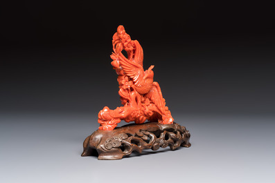 A Chinese carved red coral 'Birds and Flowers' group on a wooden stand, 19/20th C.