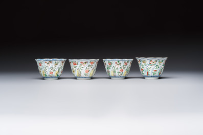 Seven Chinese famille verte cups and four saucers, conch shell and lingzhi marks, Kangxi