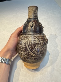 Three khmer-style brown-glazed anthropomorphic gourd-form bottles, probably 12/13th C.
