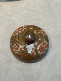 A large Chinese famille verte capucin-ground 'Prunus Blossoms' teapot and cover with relief design, Kangxi
