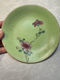 Four Chinese famille rose saucers and a gilt-decorated powder-blue-ground saucer, Qianlong and Jiaqing marks, 18/19th C.