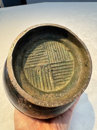 A miniature Chinese archaic bronze wine vessel with Taotie handles, 'Hu 壺', Han