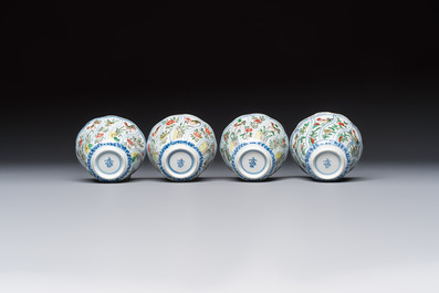 Seven Chinese famille verte cups and four saucers, conch shell and lingzhi marks, Kangxi