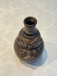 Three khmer-style brown-glazed anthropomorphic gourd-form bottles, probably 12/13th C.