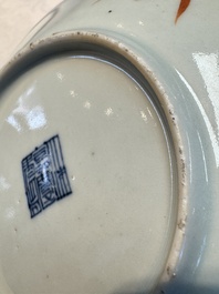 Four Chinese famille rose saucers and a gilt-decorated powder-blue-ground saucer, Qianlong and Jiaqing marks, 18/19th C.