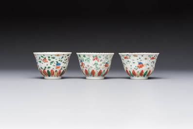 Seven Chinese famille verte cups and four saucers, conch shell and lingzhi marks, Kangxi