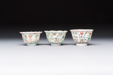 Three sets of Chinese famille verte cups and saucers with birds and flowers, various marks, Kangxi