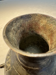A miniature Chinese archaic bronze wine vessel with Taotie handles, 'Hu 壺', Han
