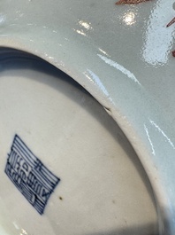 Four Chinese famille rose saucers and a gilt-decorated powder-blue-ground saucer, Qianlong and Jiaqing marks, 18/19th C.