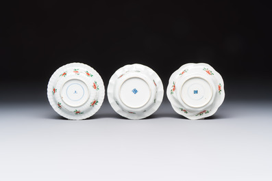 Three sets of Chinese famille verte cups and saucers with birds and flowers, various marks, Kangxi