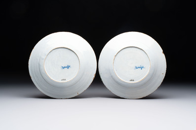 A pair of blue and white Dutch Delft inscribed plates, 18th C.