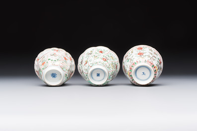 Three sets of Chinese famille verte cups and saucers with birds and flowers, various marks, Kangxi