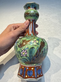 A pair of clobbered Dutch Delft vases, 17th C.