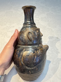 Three khmer-style brown-glazed anthropomorphic gourd-form bottles, probably 12/13th C.