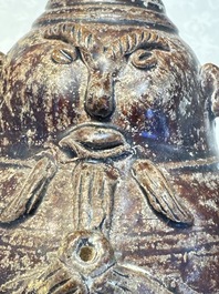 Three khmer-style brown-glazed anthropomorphic gourd-form bottles, probably 12/13th C.