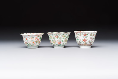 Three sets of Chinese famille verte cups and saucers with birds and flowers, various marks, Kangxi