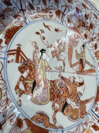 A pair of Chinese gilt iron-red-decorated 'Falconry' plates, Kangxi