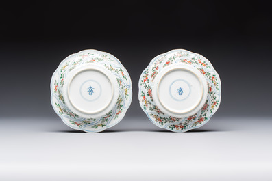 Seven Chinese famille verte cups and four saucers, conch shell and lingzhi marks, Kangxi