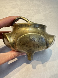 A Chinese bronze flower-shaped tripod censer with handles, Xuande mark, 19th C.