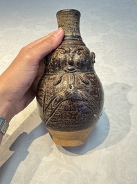 Three khmer-style brown-glazed anthropomorphic gourd-form bottles, probably 12/13th C.