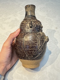 Three khmer-style brown-glazed anthropomorphic gourd-form bottles, probably 12/13th C.