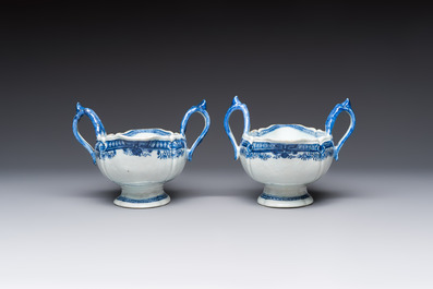 A pair of Chinese blue and white handled sauce boats and stands with pagodas along a river, Qianlong