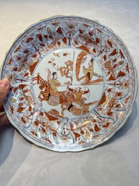 A pair of Chinese gilt iron-red-decorated 'Falconry' plates, Kangxi
