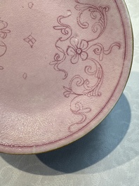 Four Chinese famille rose saucers and a gilt-decorated powder-blue-ground saucer, Qianlong and Jiaqing marks, 18/19th C.