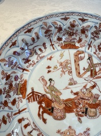 A pair of Chinese gilt iron-red-decorated 'Falconry' plates, Kangxi