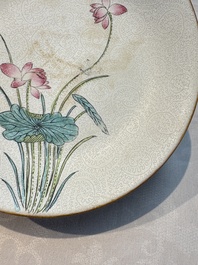 Four Chinese famille rose saucers and a gilt-decorated powder-blue-ground saucer, Qianlong and Jiaqing marks, 18/19th C.