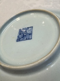 Four Chinese famille rose saucers and a gilt-decorated powder-blue-ground saucer, Qianlong and Jiaqing marks, 18/19th C.
