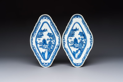 A pair of Chinese blue and white handled sauce boats and stands with pagodas along a river, Qianlong