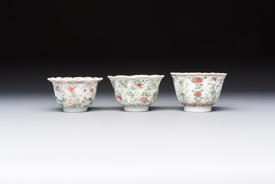 Three sets of Chinese famille verte cups and saucers with birds and flowers, various marks, Kangxi