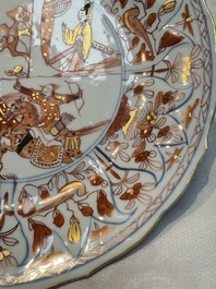 A pair of Chinese gilt iron-red-decorated 'Falconry' plates, Kangxi