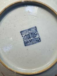 Four Chinese famille rose saucers and a gilt-decorated powder-blue-ground saucer, Qianlong and Jiaqing marks, 18/19th C.