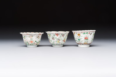 Three sets of Chinese famille verte cups and saucers with birds and flowers, various marks, Kangxi