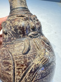 Three khmer-style brown-glazed anthropomorphic gourd-form bottles, probably 12/13th C.