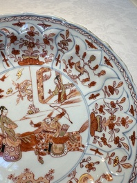 A pair of Chinese gilt iron-red-decorated 'Falconry' plates, Kangxi