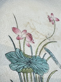 Four Chinese famille rose saucers and a gilt-decorated powder-blue-ground saucer, Qianlong and Jiaqing marks, 18/19th C.