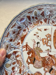 A pair of Chinese gilt iron-red-decorated 'Falconry' plates, Kangxi